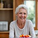 Content woman in her late 60s, Maria, enjoying a healthy meal.